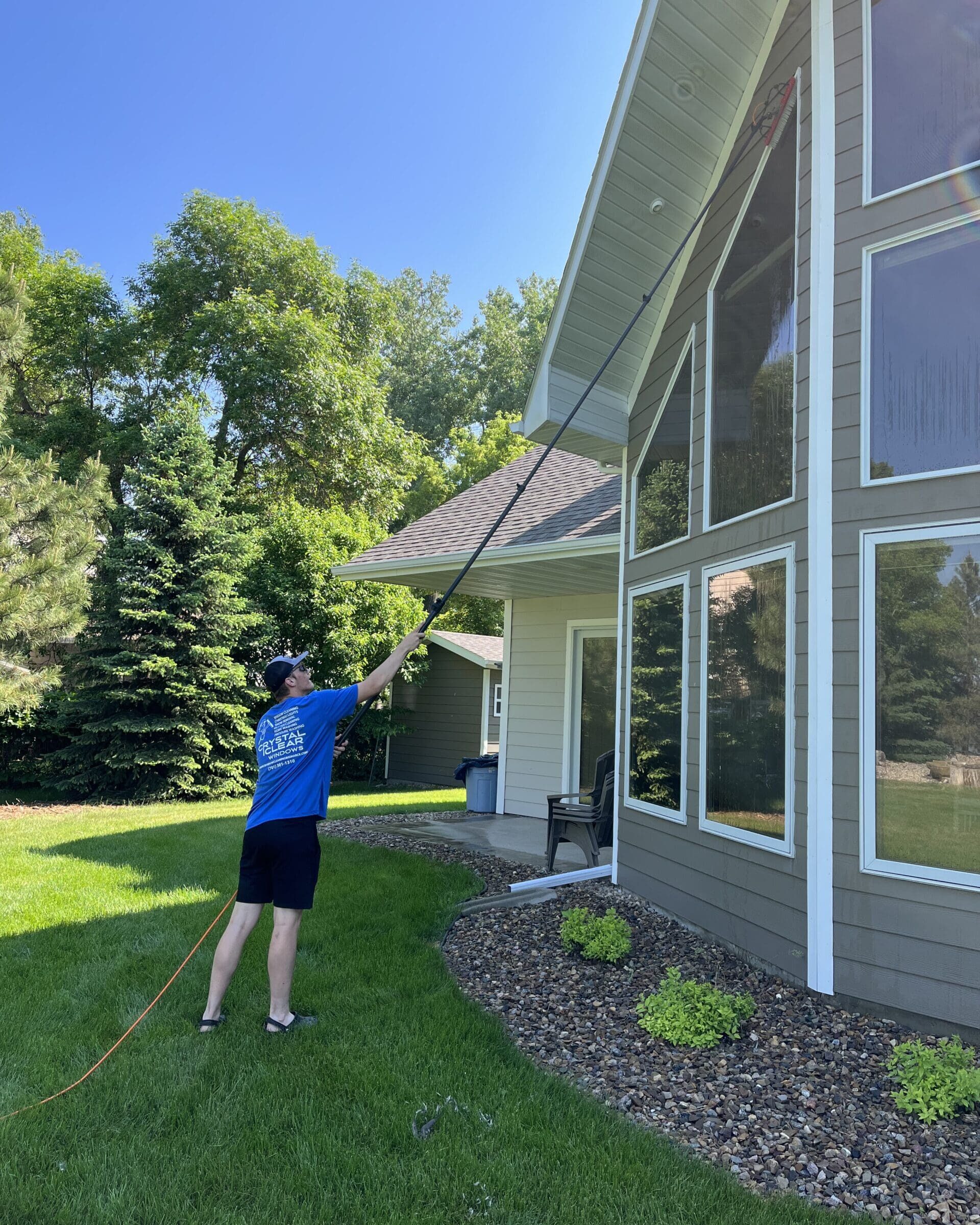 Crystal Clear Professional cleaning residential window in North Dakota.
