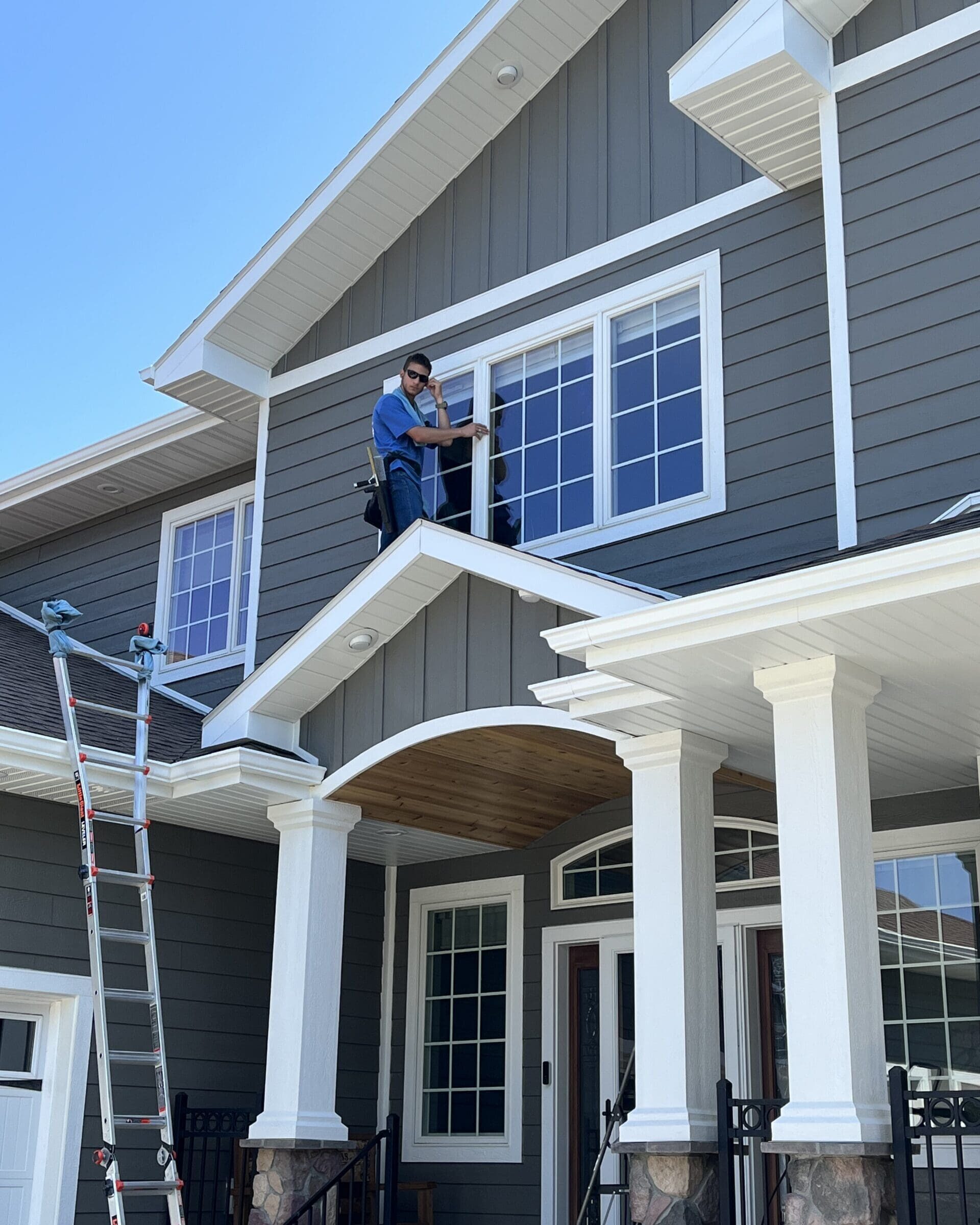 Professional window cleaners on second story residential job.